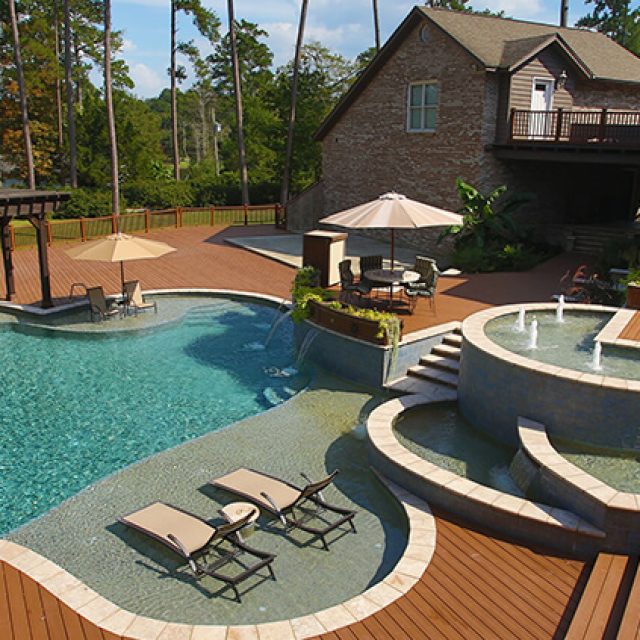 Natural swimming pool with water feature - Master Pools Guild