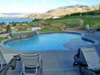 Freeform pool with water feature - Master Pools Guild