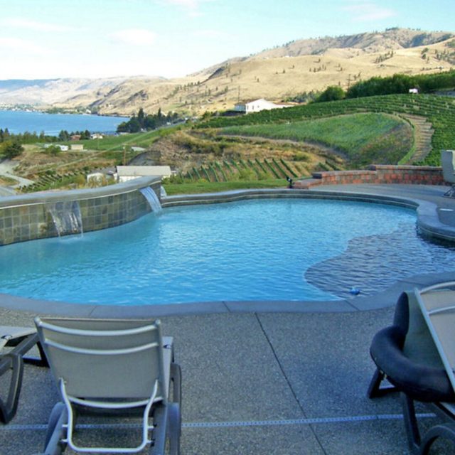 Freeform pool with water feature - Master Pools Guild