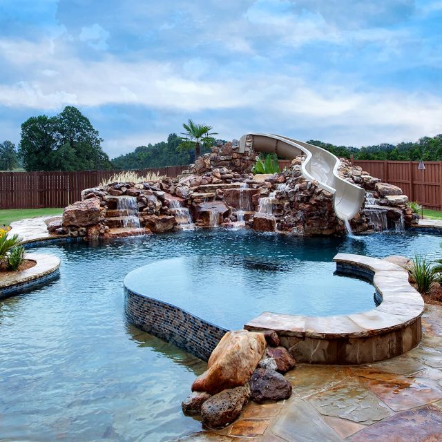Natural swimming pool with kids water feature - Master Pools Guild
