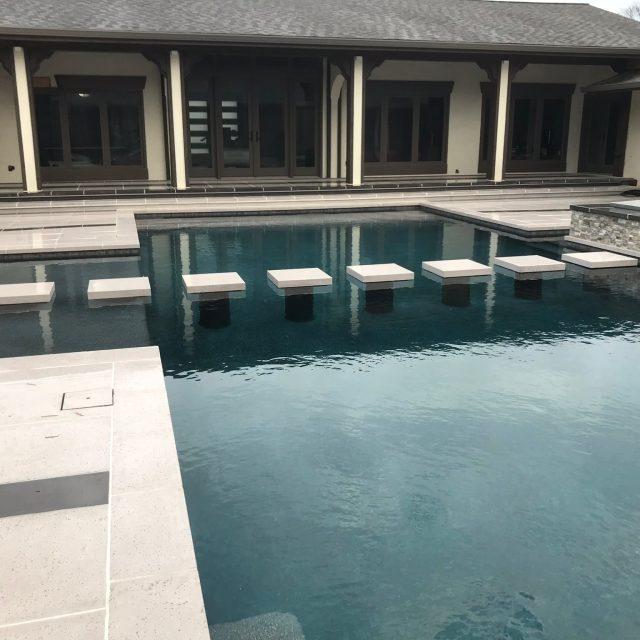 Residential traditional pool with water feature - Master Pools Guild