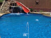 Freeform pool with kids water feature - Southwest Pools & Spas - Master Pools Guild